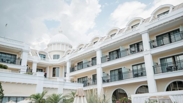 A classic resort facade under a bright sky, perfect for travel and vacation imagery.